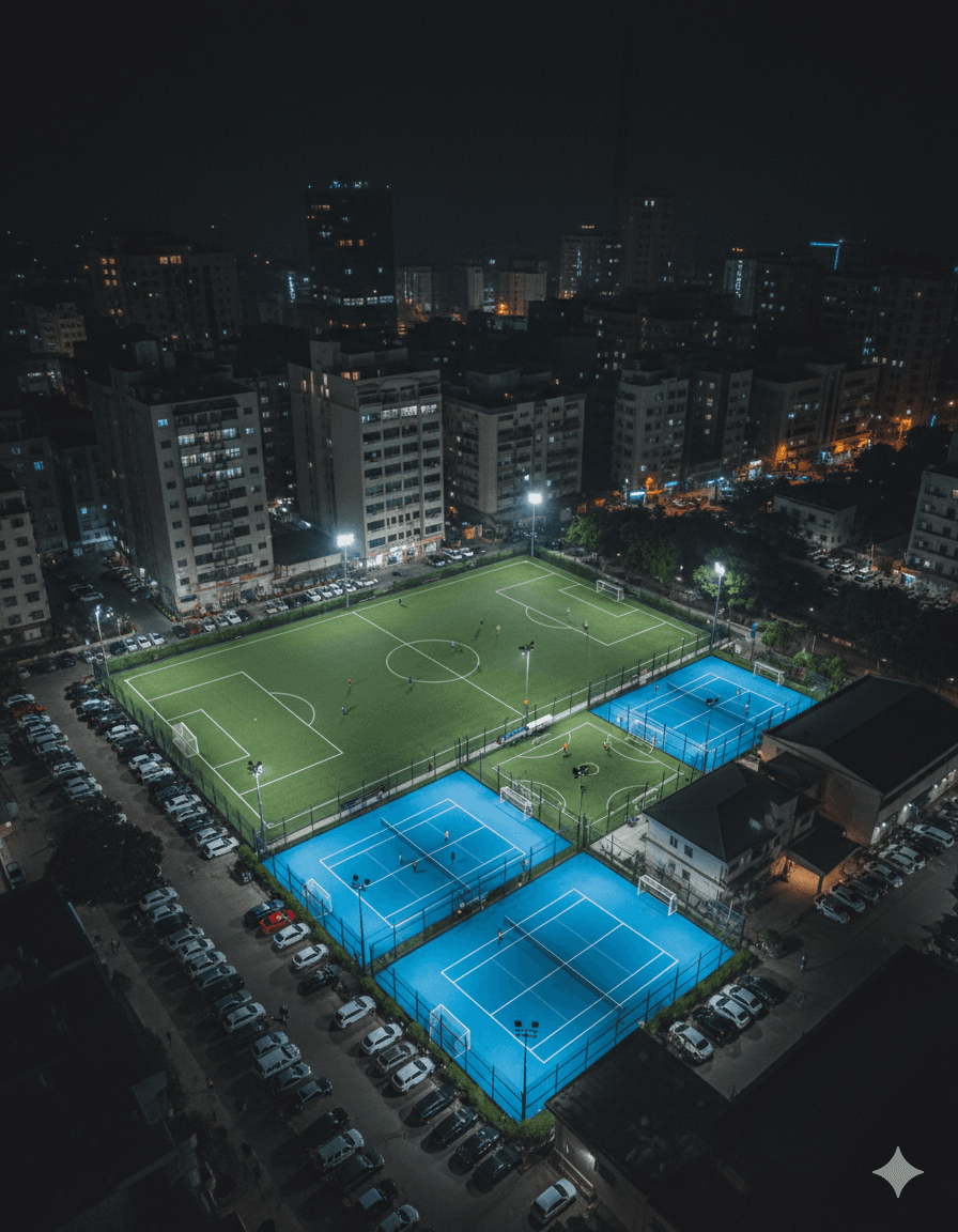 Aerial view of lit sports courts at night